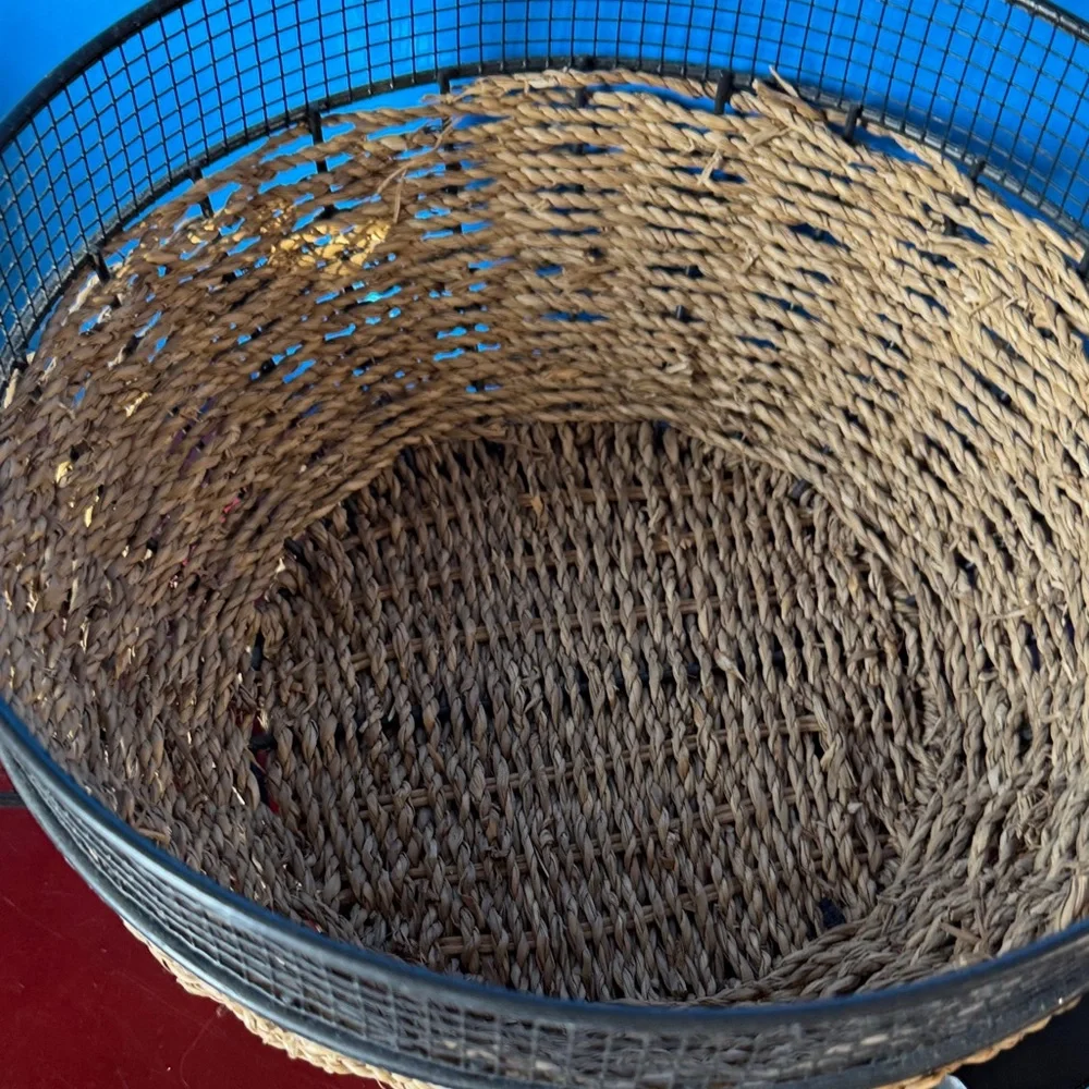 Vintage metal and woven basket designed to look like a large coffee cup.